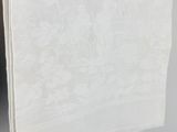 white linen table cloth with a floral design