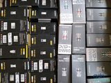 many boxes of electronic devices stacked on top of each other