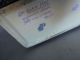a sign on the back of a refrigerator that says it ' s not here yet