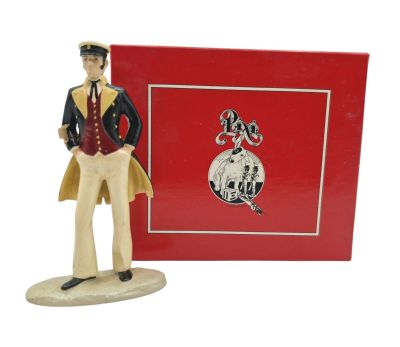 figurine of a man in a top hat with a red box behind him