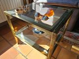 a glass table with oranges on it in a living room