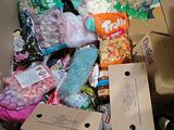 a cardboard box filled with assorted food and snacks