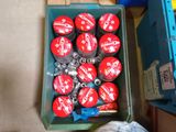 a plastic container filled with red soda bottles next to a blue box