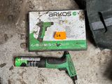 a box of tools sitting on the ground next to a pair of scissors
