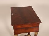 a small wooden table with a drawer on top of it