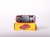 a red toy car sitting on top of a yellow box
