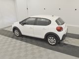 a picture of a white car parked in a garage