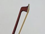 a close up of a pair of chopsticks with a wooden handle