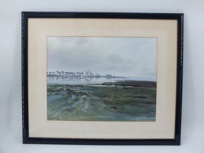 aquarelle encadrée représentant une scène de plage avec un phare au loin