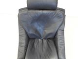 a black leather chair with a black seat and back rest