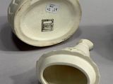 three white porcelain vases sitting next to each other on a table