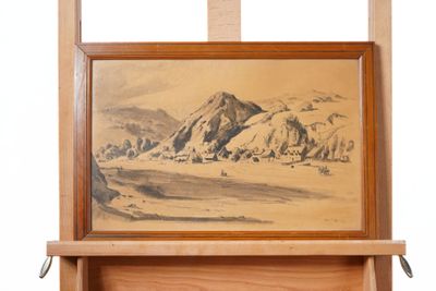 a picture of a painting hanging on a wooden easel