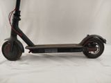 an electric scooter sitting on a white surface with a white background
