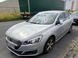 a silver car parked on the side of the road