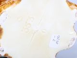 a close up of a vase with a label on it