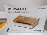 a white box with a yellow lid sitting on a table