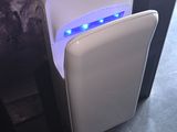 a white toilet with a blue light in it