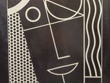 an image of a black and white drawing of a man ' s face