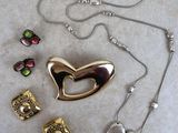 silver and gold heart necklace, earrings, and bracelet