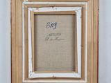 an old picture frame with a picture of a dog on it
