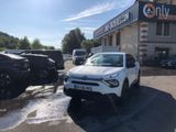 a white suv parked in front of a building