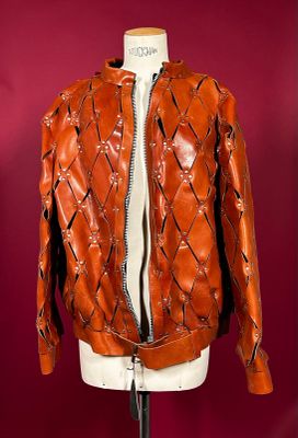 an orange leather jacket on a mannequin mannequin mannequin mannequin mannequin mannequin mannequin mannequin manne