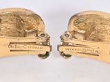 pair of gold plated cuff rings with a lion and a lion head
