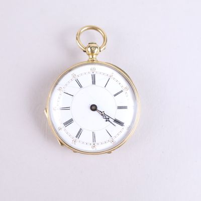 a gold pocket watch with roman numerals on the face