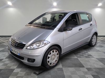 a picture of a silver car parked in a garage