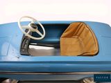 a blue toy car with a steering and a brown seat