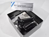 a box with a bunch of black bicycle parts inside of it