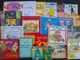 many children ' s books that are on the table