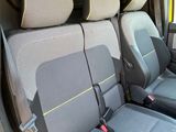two seats in the back of a van with a key in it