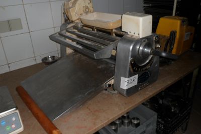 a machine that is sitting on a table in a kitchen