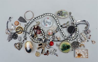 many different types of jewelry on a white surface