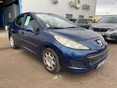 a picture of a blue car parked in front of a building
