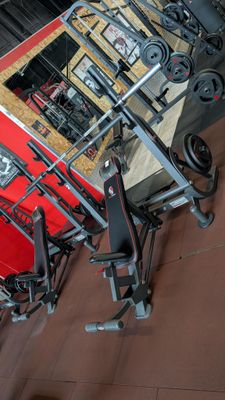 a lot of gym equipment on the floor in the room