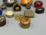 many different types of decorative boxes on the table