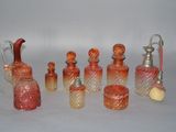 a lot of glass bottles that are sitting on a table