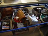 boxes of assorted items are sitting on a table in a room