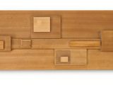 a picture of a piece of wood that is made to look like a puzzle