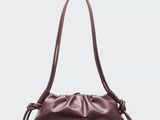 the pouch bag in burgundy leather