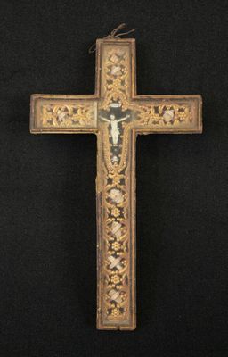 an old wooden cross with a cross on it on a black background