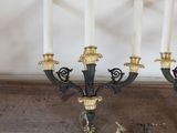 four candles that are sitting on a table
