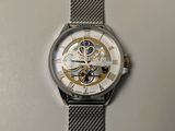 a close up of a watch on a table