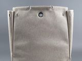 the small canvas tote bag is made from natural linen