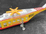 a toy helicopter that is sitting on the ground
