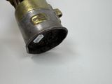 a close up of a metal object on a white surface