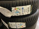 three tires stacked on top of each other in a garage
