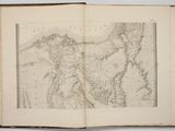 an open book with a map of the world on it